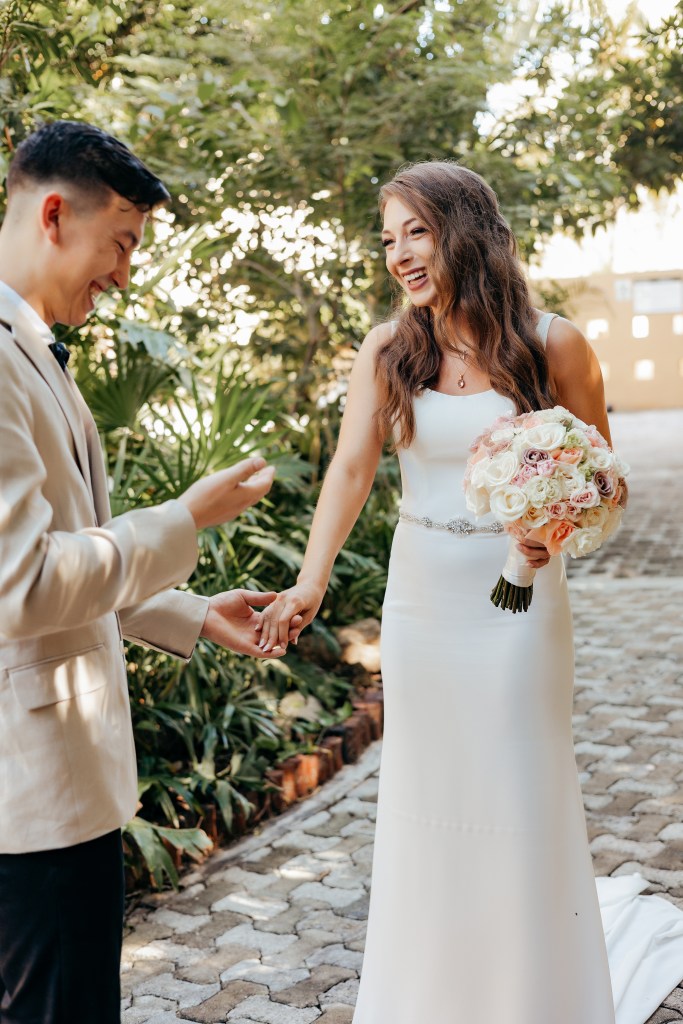 bride and groom seeing eachother for the first time on wedding day