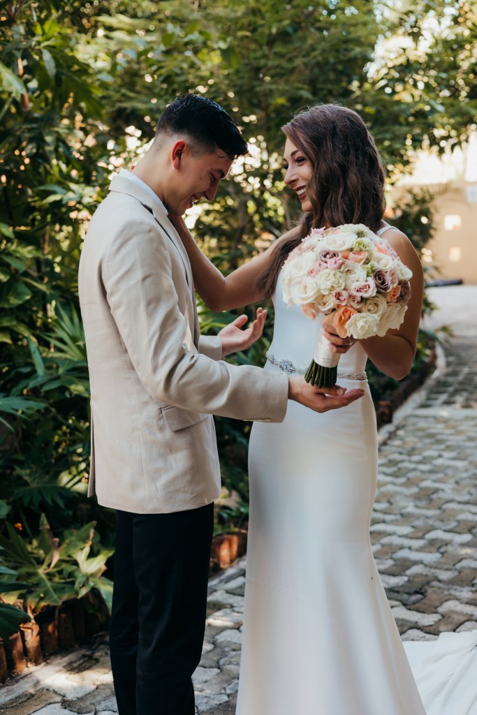 groom in awe of his beautiful bride during a first look in Mexico wedding