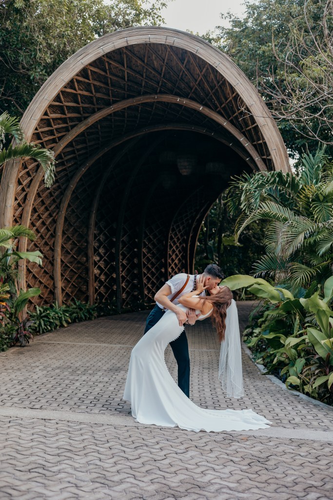 groom dipping bride at hotel resort in Playa Del Carmen 
